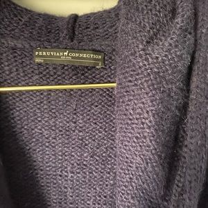 Hooded, below knee length wool sweater coat